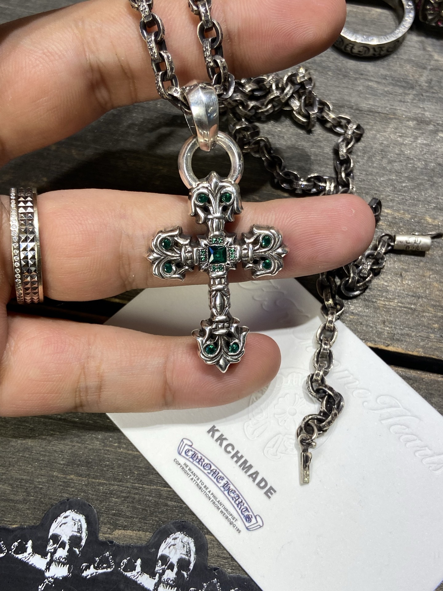 Customer order: Medium-sized flame cross necklace with green diamond setting + PP letter chain