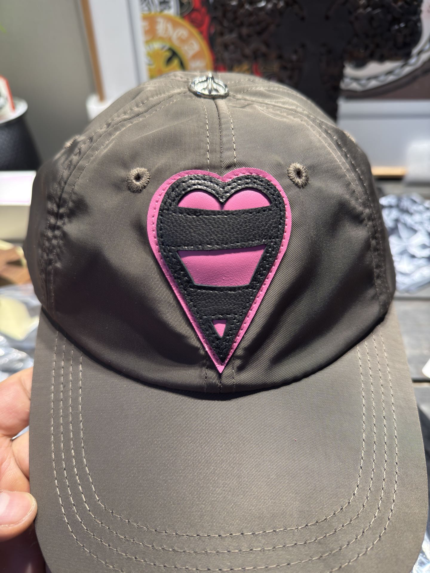 Custom-ordered heart-shaped baseball cap with exclusive D-ring buckle/cross top buckle + premium car emblem.