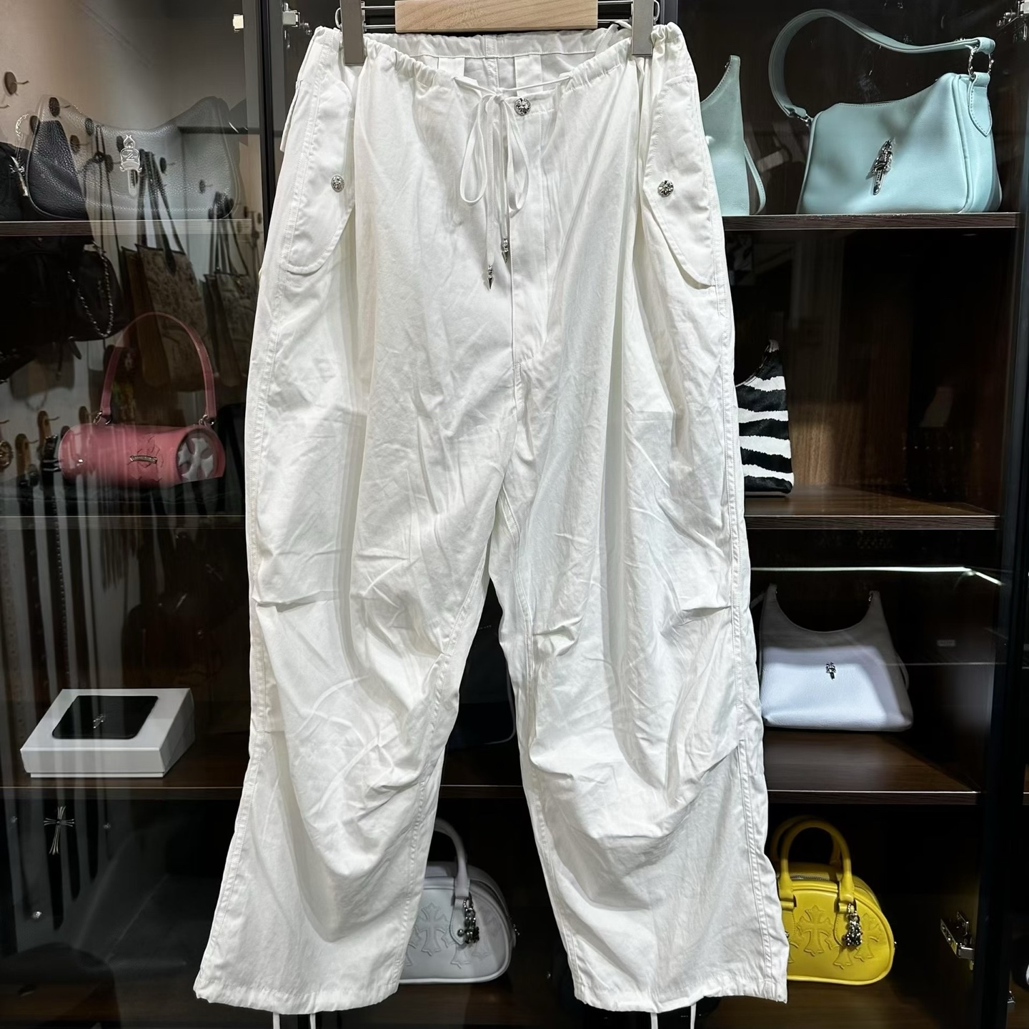 Chrome Hearts Heavyweight Paratrooper Pants with Colorful Crosses. A relaxed, laid-back fit, suitable for waist sizes 66-100cm. The fabric is custom-woven and dyed, requiring a carbon-brushed finish on the front followed by a brushed finish (resultin