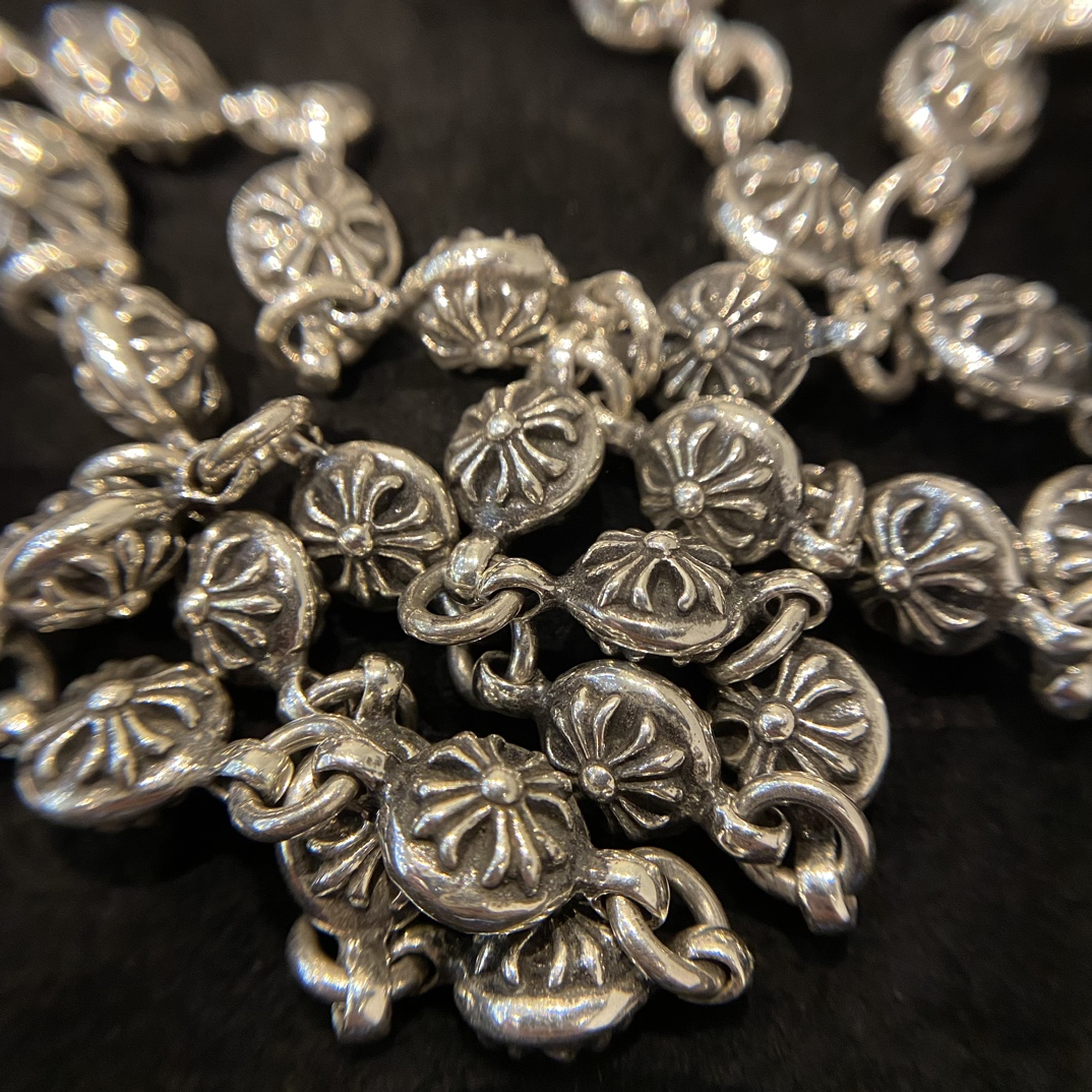 Chrome HeartsCross Flower Ball Bag Chain - Vintage QualityAuthentic Pattern - Authentic Antique Engraving & Oxidation TextureSteel Mold Pattern - Total Length (including lobster clasp): 65cm - Weight: 160g - Entirely 925 Sterling Silver - Material