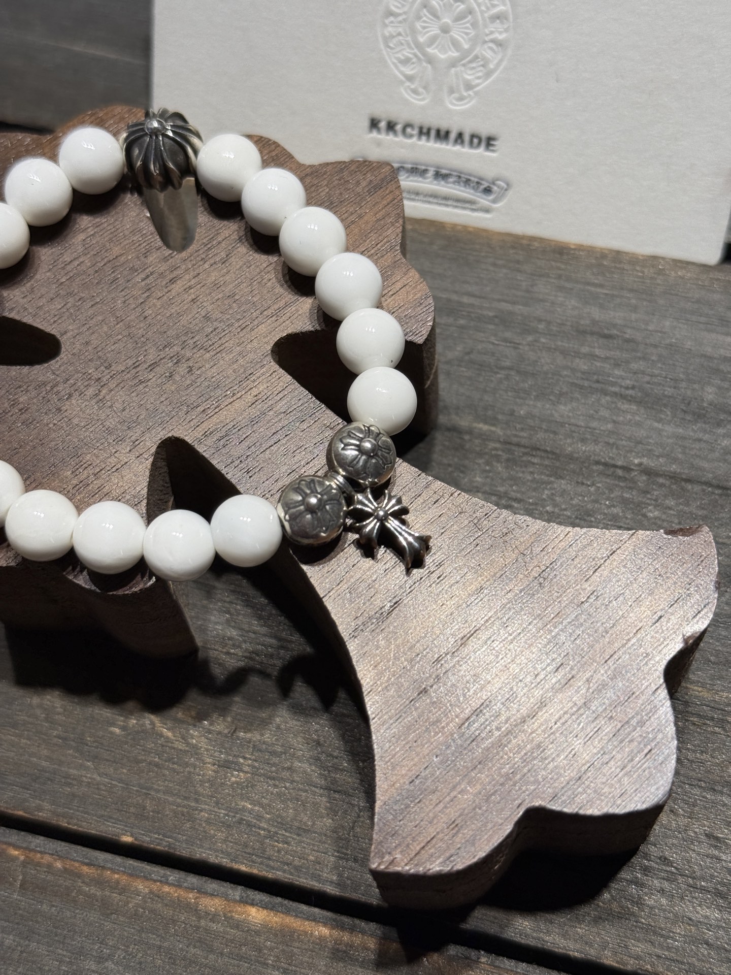 White agate cross silver bead bracelet available now.