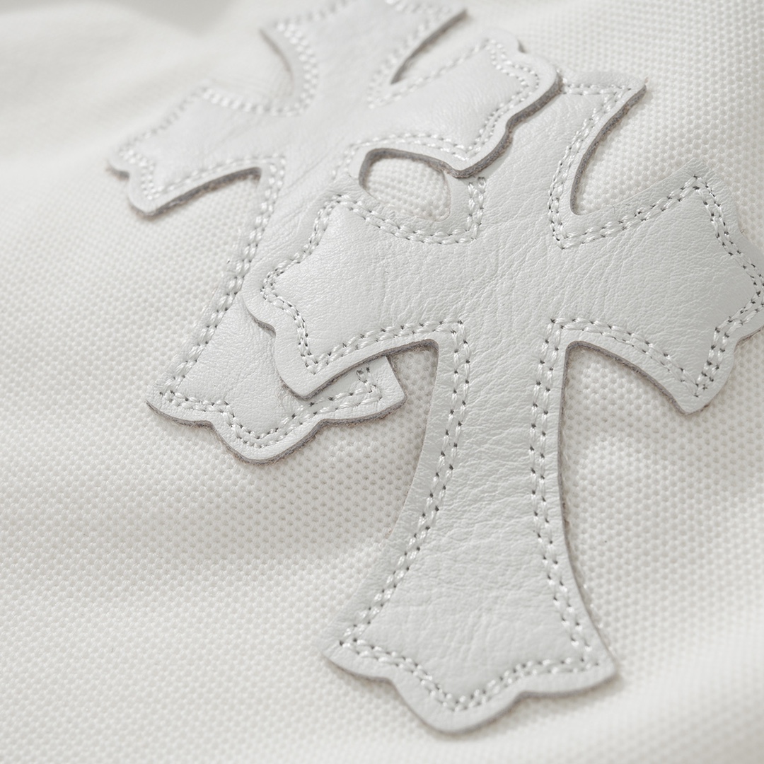 CH Chrome Hearts Exclusive Polo Shirt in Patchwork LeatherThe fabric is made of pique satin, incredibly smooth and comfortable against the skin with a cool feel. It features three top-grain cowhide cross panels on the front and back, and the neck la