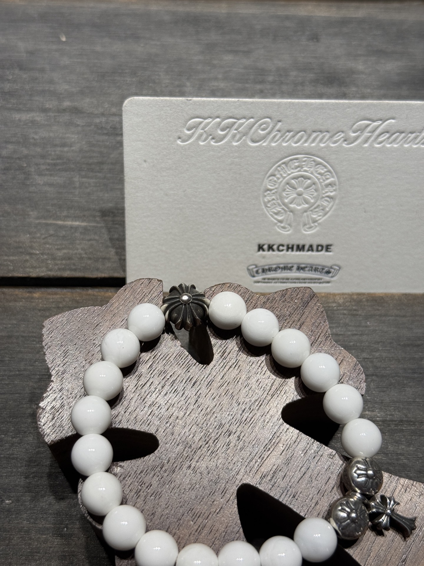 White agate cross silver bead bracelet available now.