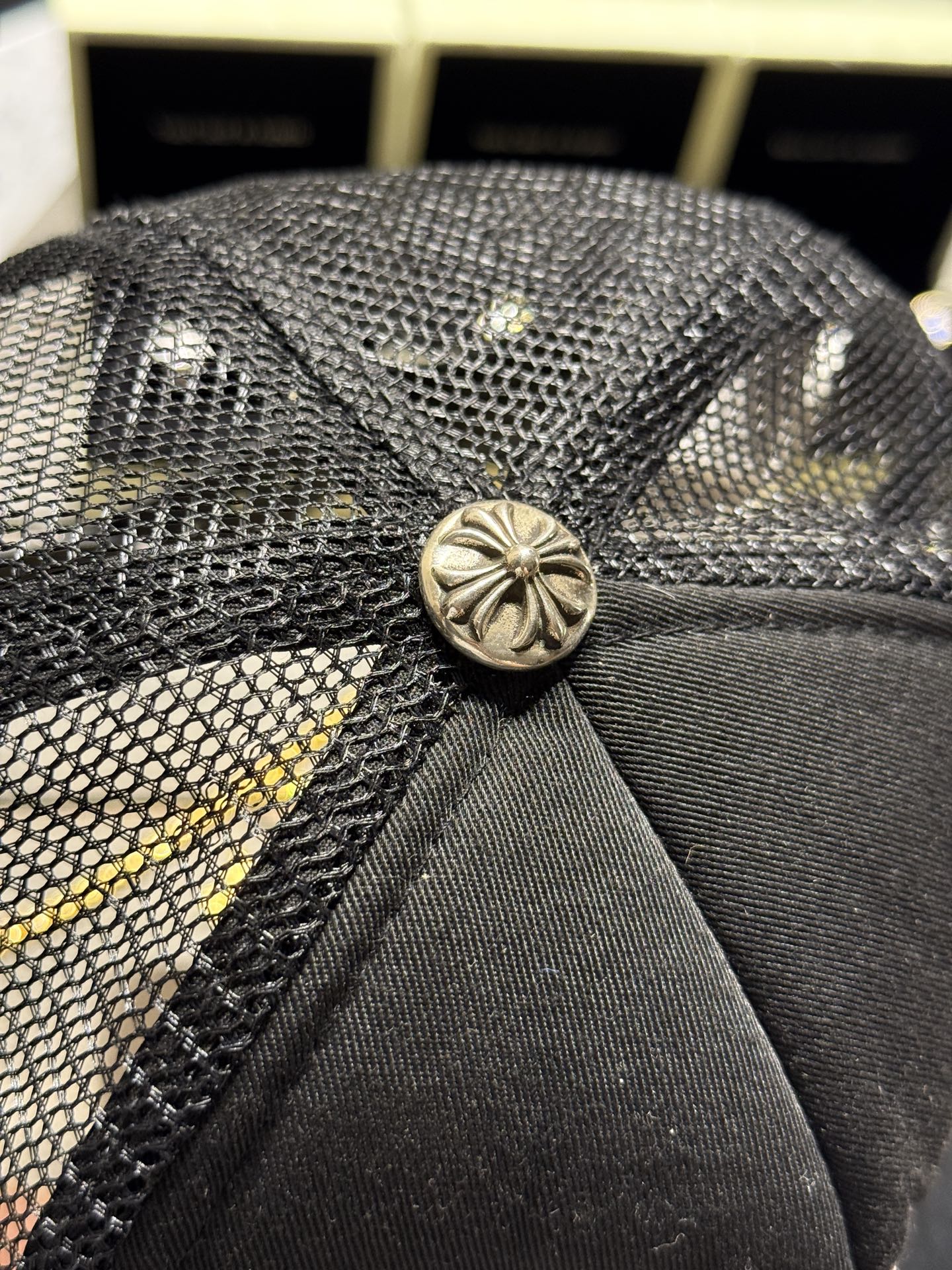 Custom-ordered 30-cross baseball cap with sterling silver buckle and premium car emblem.