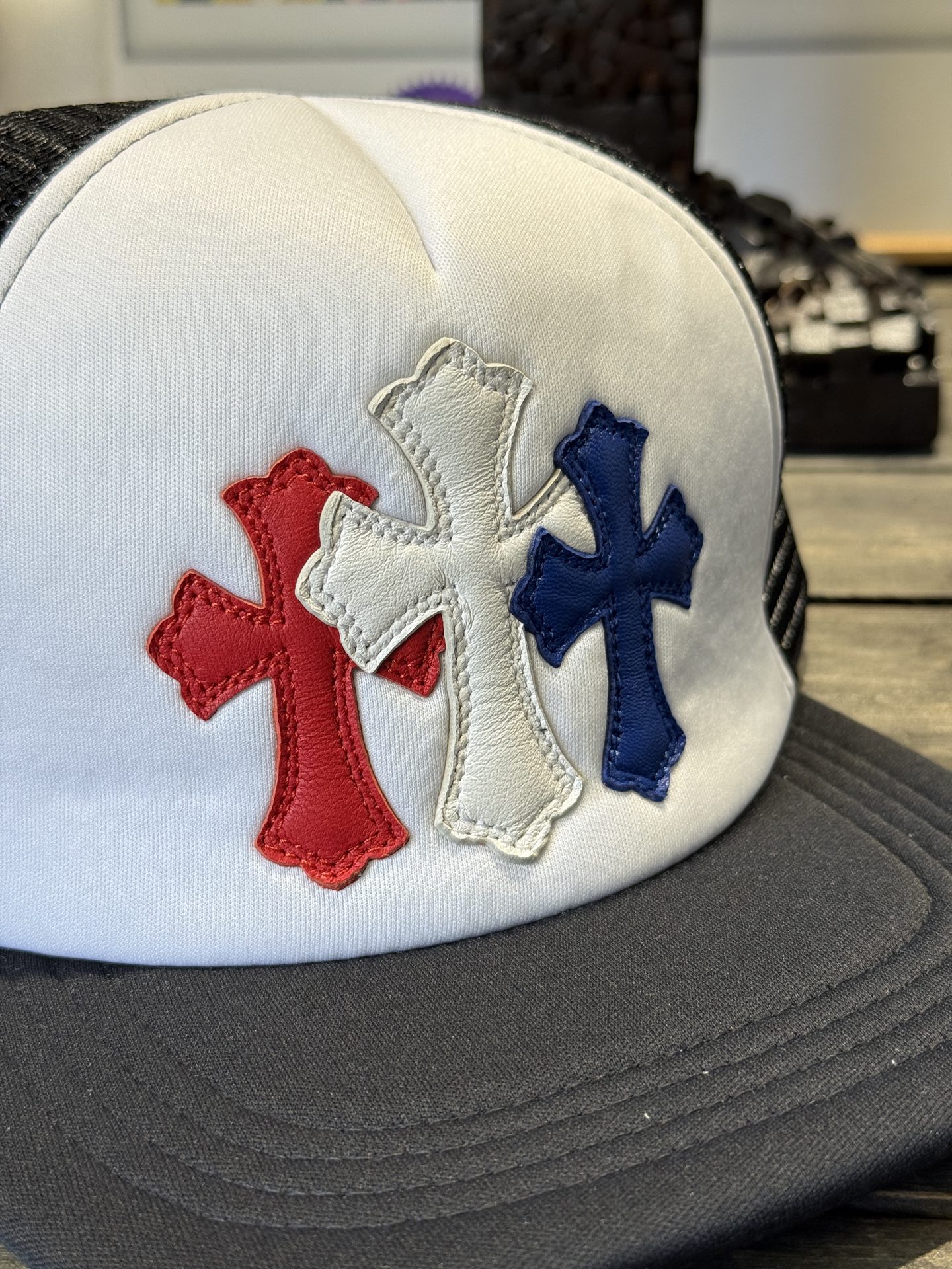 Custom-ordered 30-cross baseball cap with sterling silver buckle and premium car emblem.