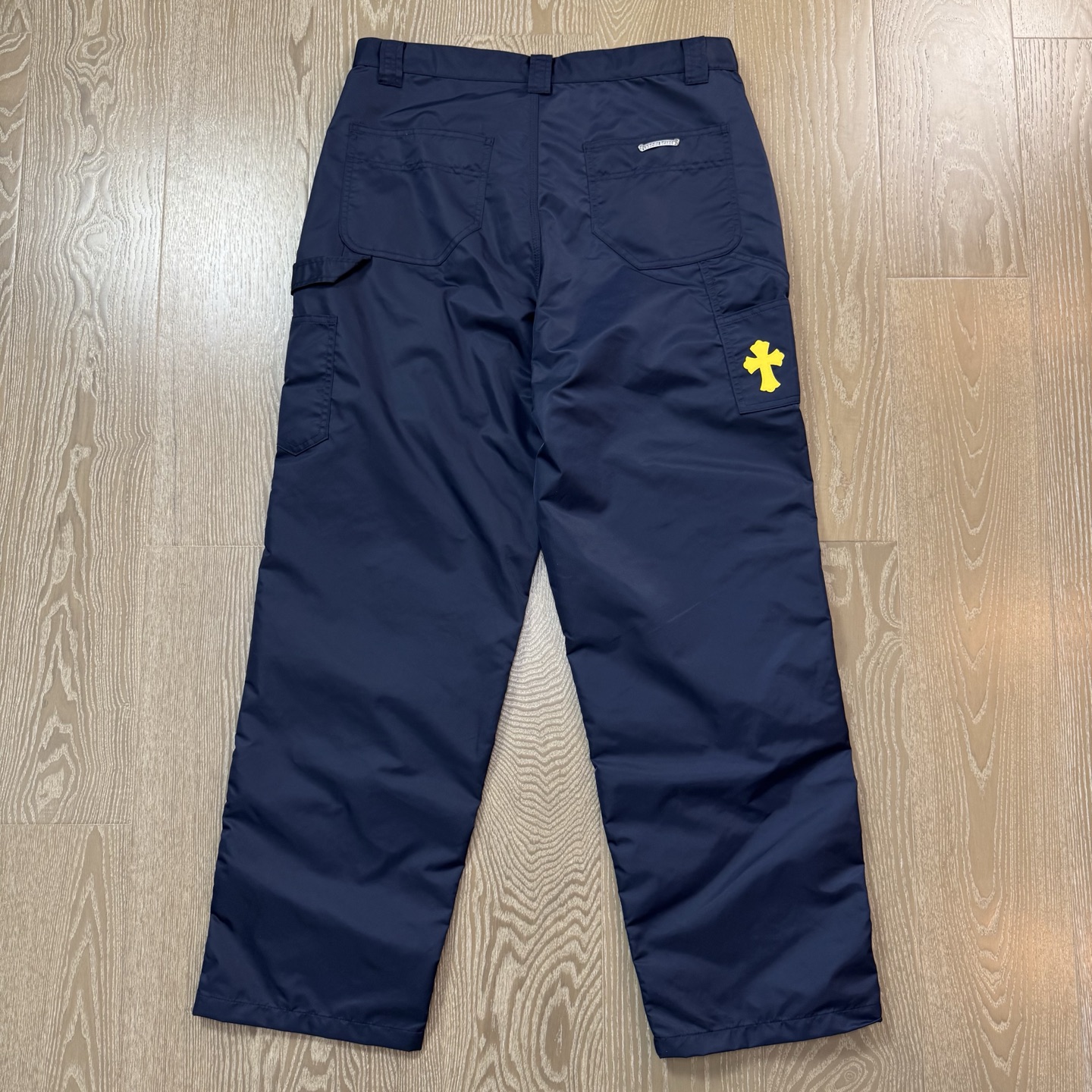 Chrome Hearts New Pants with Leather Patched and Logging FeaturesMatched design and color; silver-plated hardwareYellow leather cross on the backBoth knees are made from a single piece of leatherSizes 28, 30, 32, 34