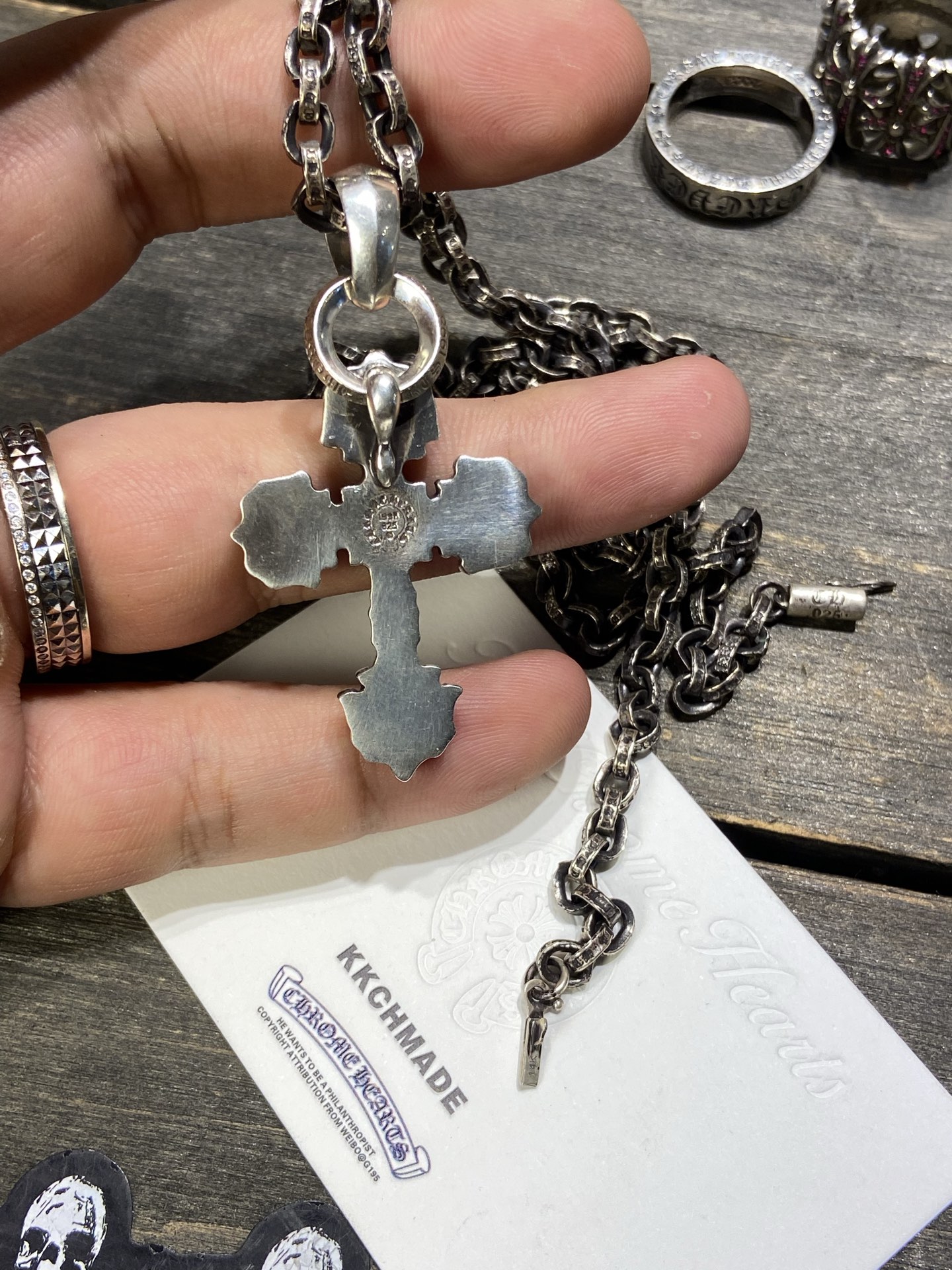 Customer order: Medium-sized flame cross necklace with green diamond setting + PP letter chain