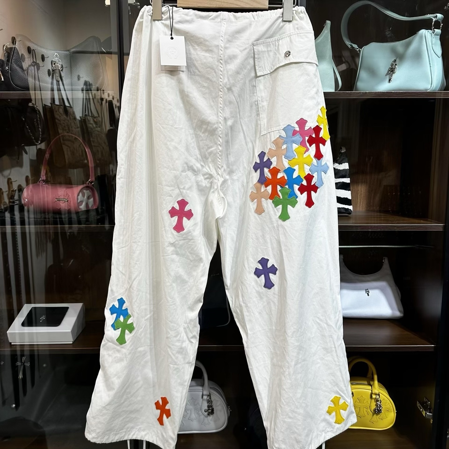 Chrome Hearts Heavyweight Paratrooper Pants with Colorful Crosses. A relaxed, laid-back fit, suitable for waist sizes 66-100cm. The fabric is custom-woven and dyed, requiring a carbon-brushed finish on the front followed by a brushed finish (resultin