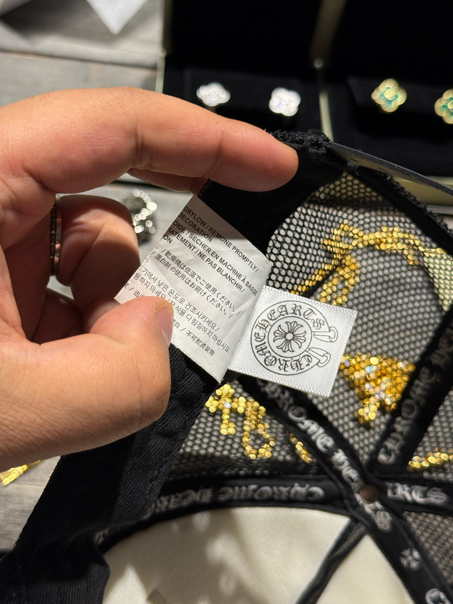 Custom-ordered 30-cross baseball cap with sterling silver buckle and premium car emblem.