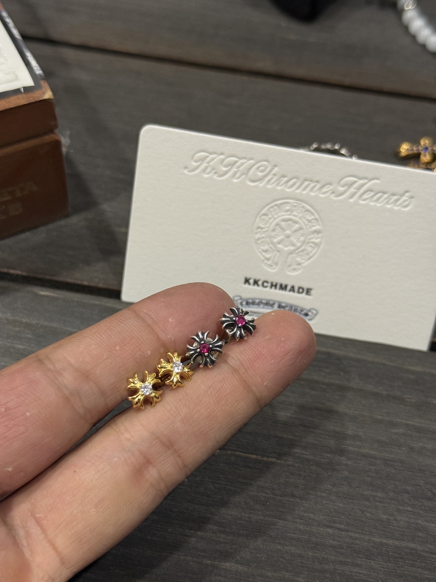 Ordered 22k gold diamond & red diamond square cross earrings