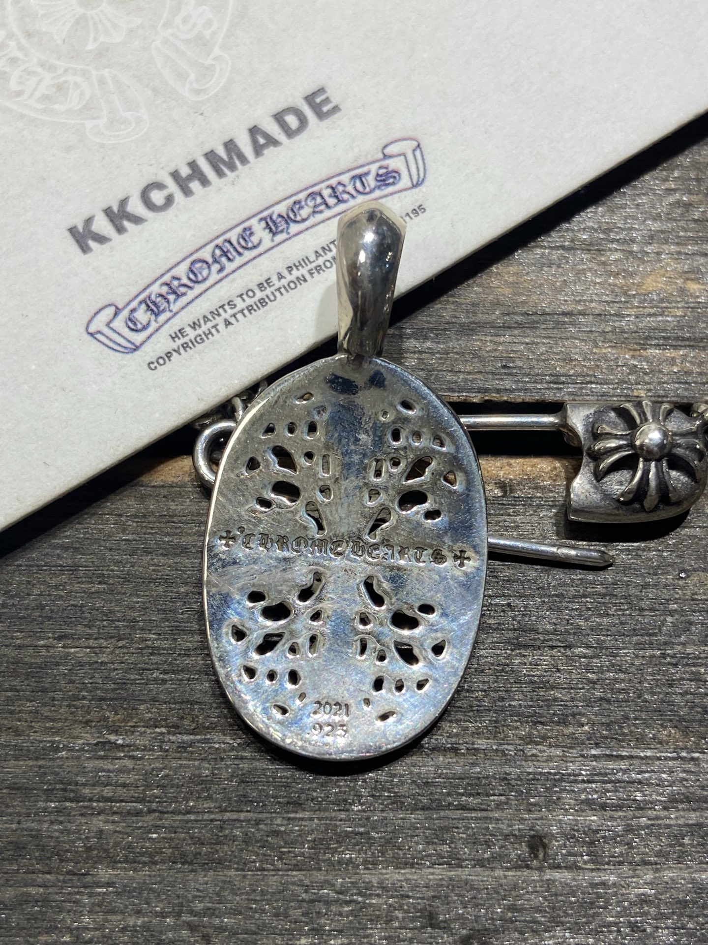 Cross vine pendant, available now.