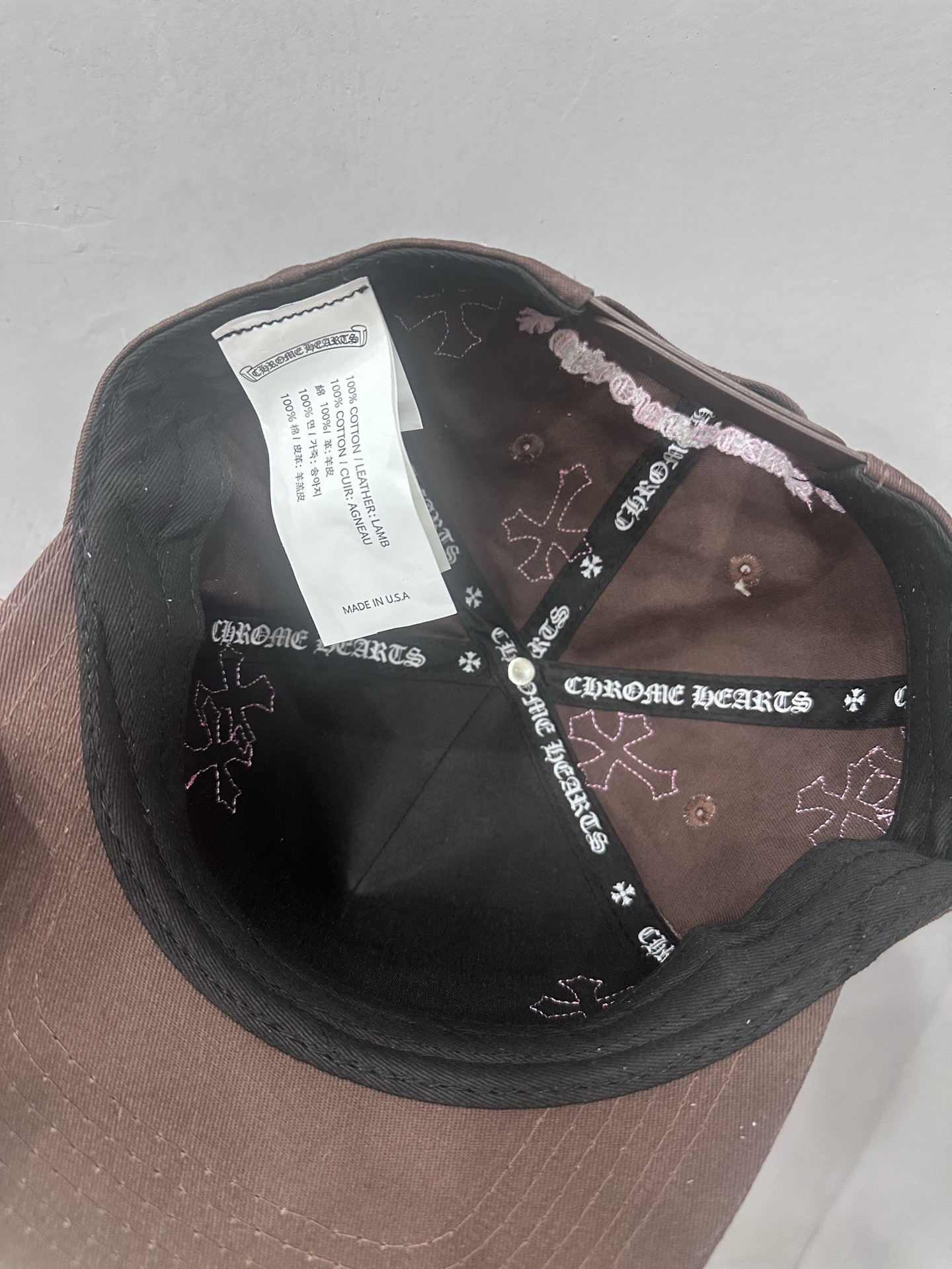 CH brown and pink striped baseball cap with a pink leather strap. Truck-style hat.