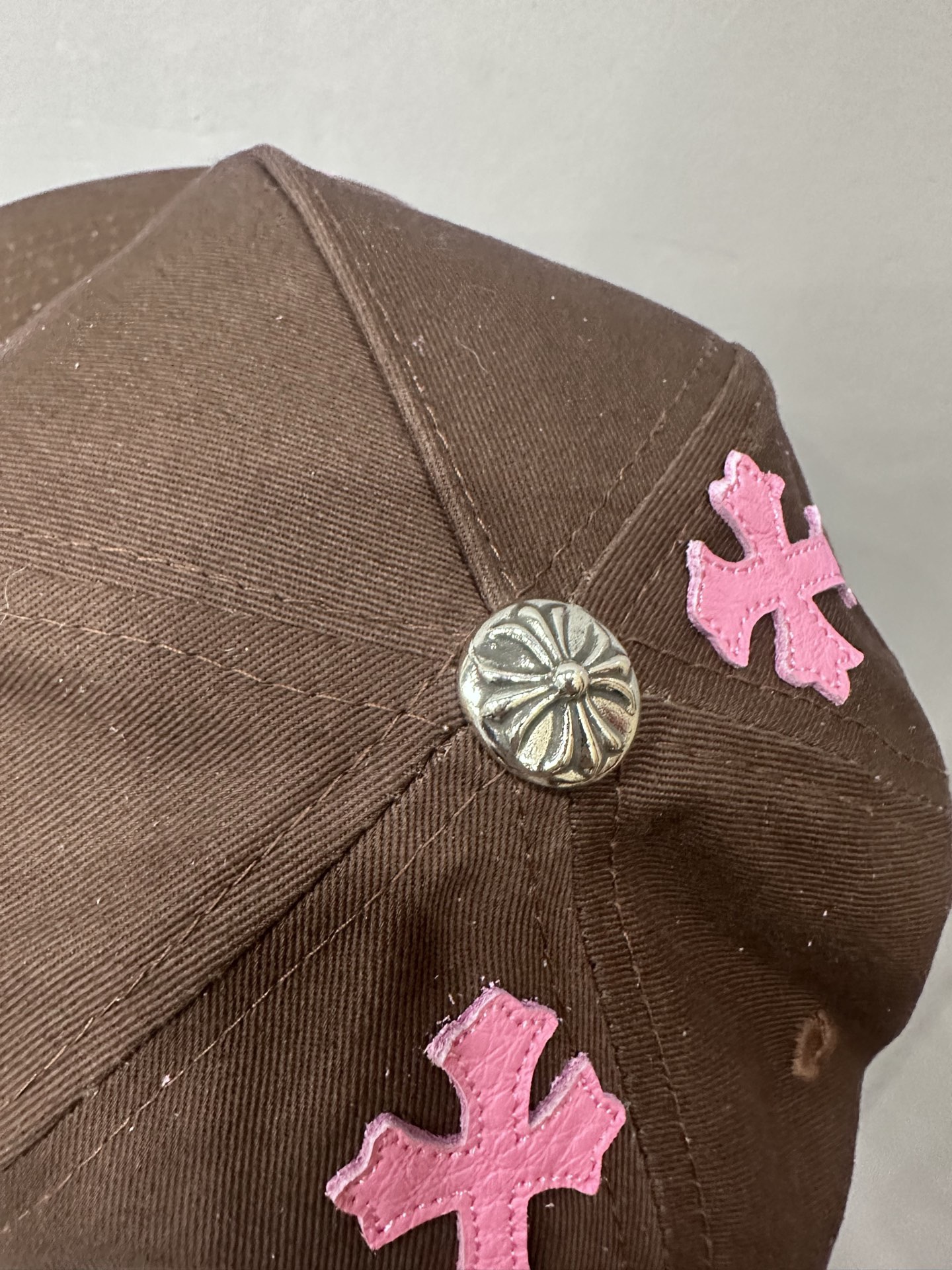 CH brown and pink striped baseball cap with a pink leather strap. Truck-style hat.