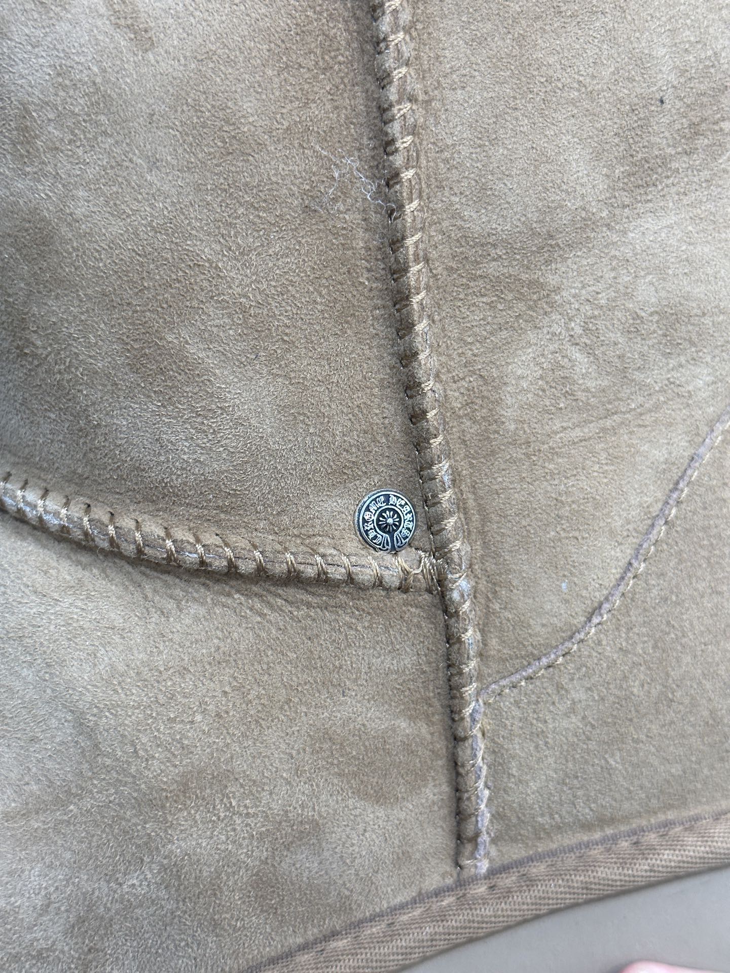 CH x UGG Cardigan-style fur-and-leather one-piece rolled-up mid-calf snow boots.